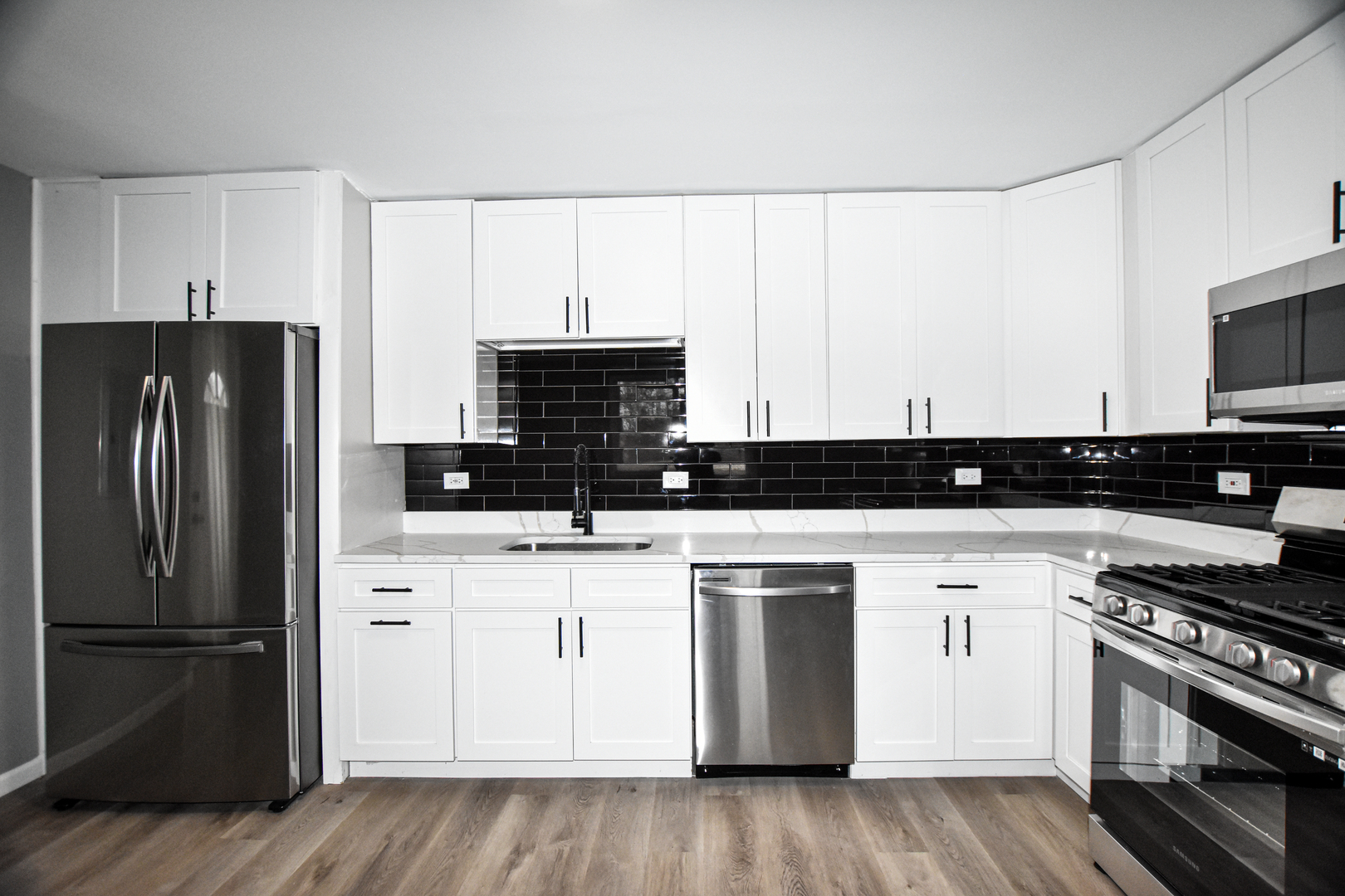 109 South Bartlett Road Streamwood, IL 60107 - Photo 6 of 39 a kitchen with a refrigerator and a stove top oven