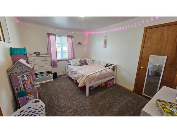 a living room with a bed and furniture