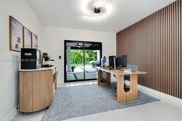 a kitchen with stainless steel appliances kitchen island granite countertop a stove and a sink