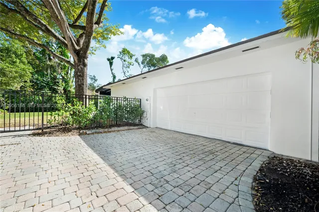 a view of a backyard of the house