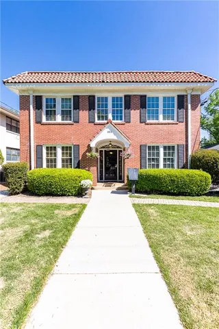 a front view of a house with swimming pool