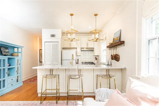 a view of kitchen with wooden floor and chair
