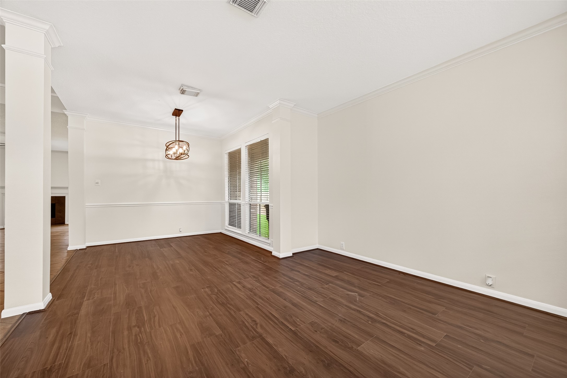 12831 Dove Point Lane Houston, TX 77041 - Photo 10 of 50 Combining a formal living room and dining room creates a versatile, elegant space designed for entertaining, maximizing both flow and functionality.