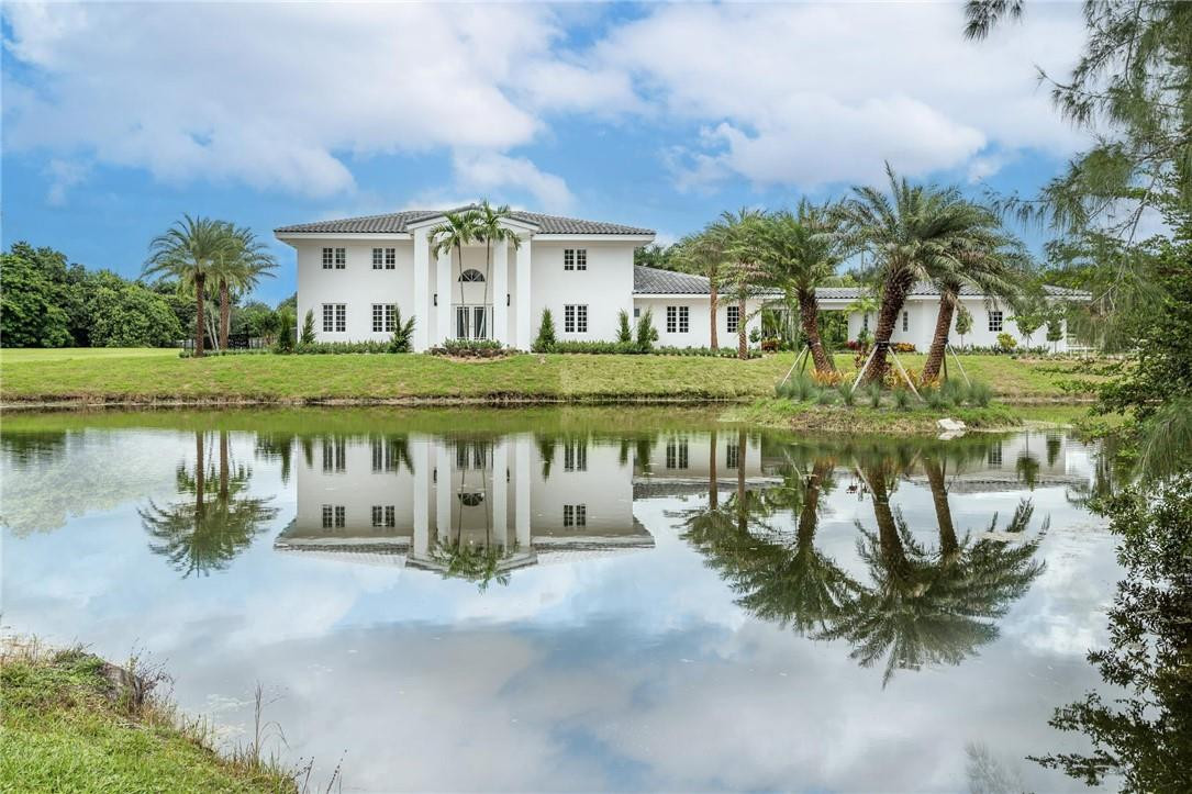 13731 Stirling Road Southwest Ranches, FL 33330 - Photo 1 of 55 a view of a house with a yard