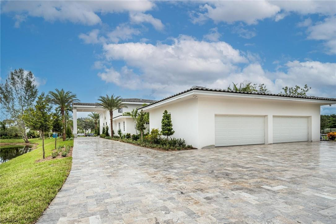 13731 Stirling Road Southwest Ranches, FL 33330 - Photo 12 of 55 a view of a house with a yard