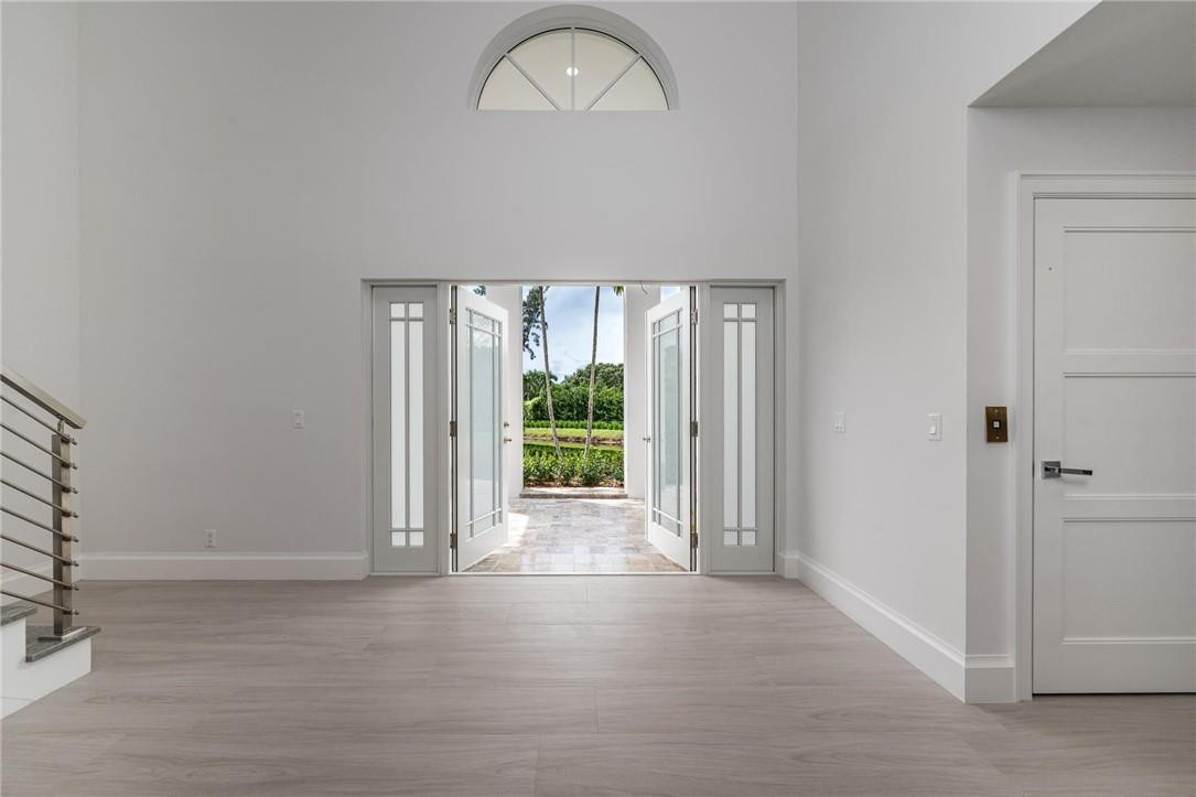 13731 Stirling Road Southwest Ranches, FL 33330 - Photo 17 of 55 an empty room with wooden floor and a window