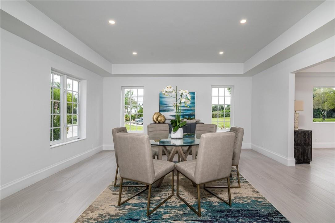 13731 Stirling Road Southwest Ranches, FL 33330 - Photo 18 of 55 a view of a dining room with furniture window and wooden floor