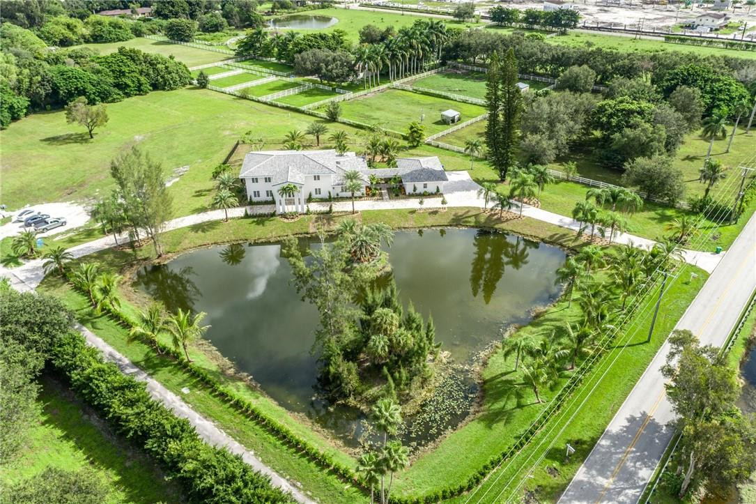 13731 Stirling Road Southwest Ranches, FL 33330 - Photo 2 of 55 an aerial view of residential houses with outdoor space and swimming pool
