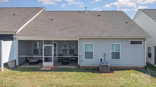 a view of a house with backyard and balcony