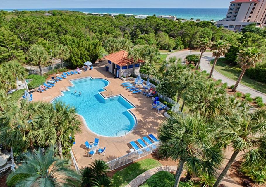 an aerial view of a house with a yard and garden