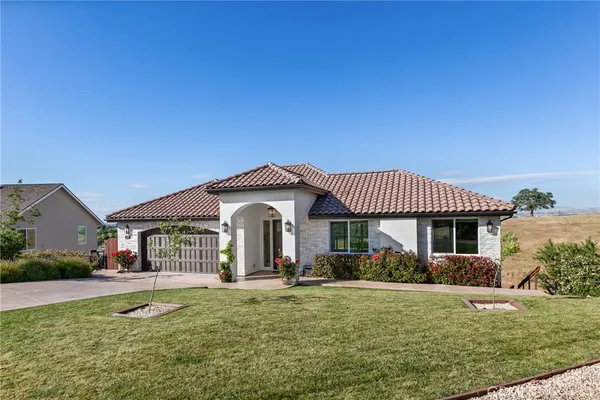 a front view of a house with a yard