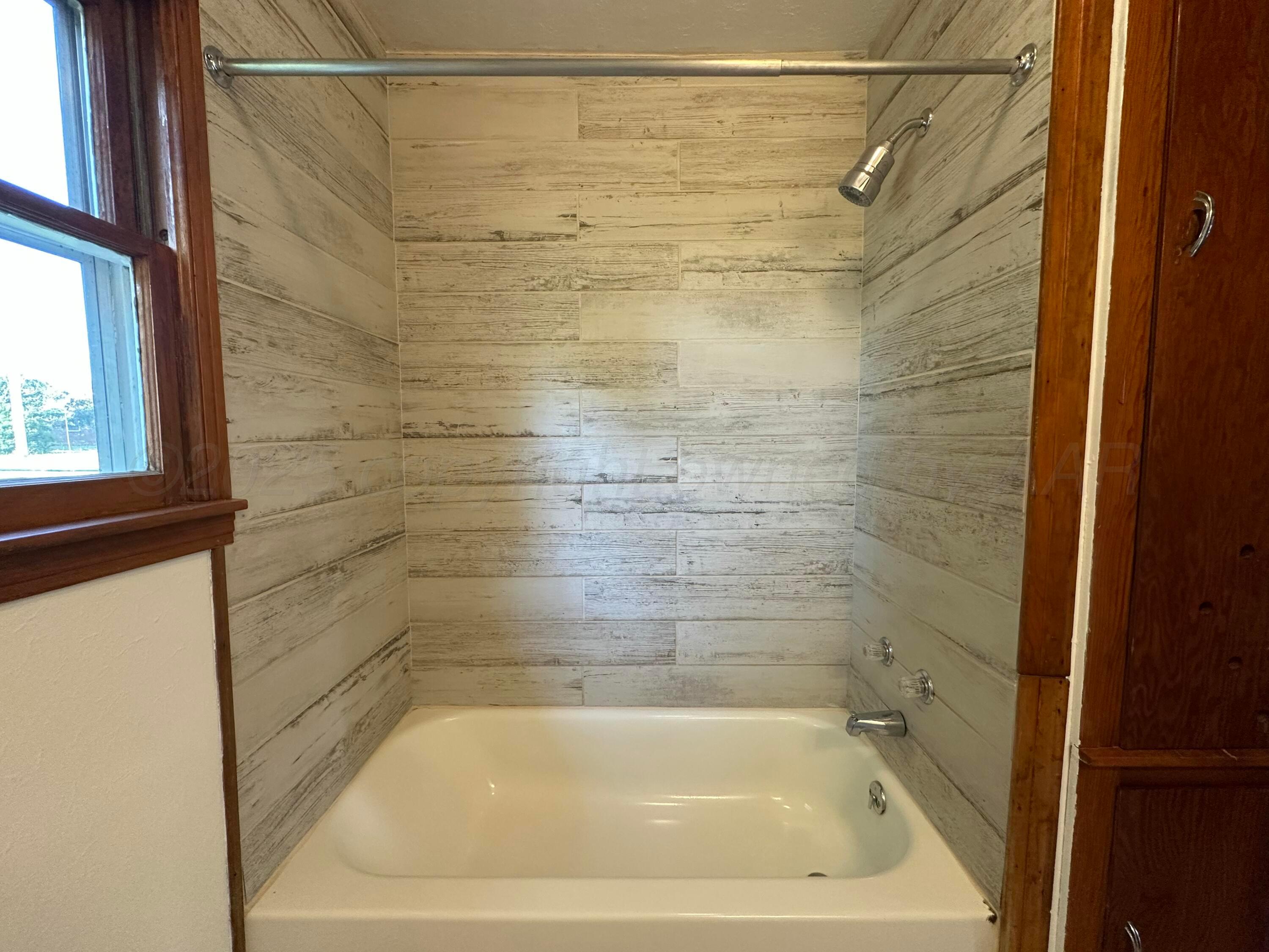 913 Bell Avenue Turkey, TX 79261 - Photo 11 of 18 a bathroom with a shower