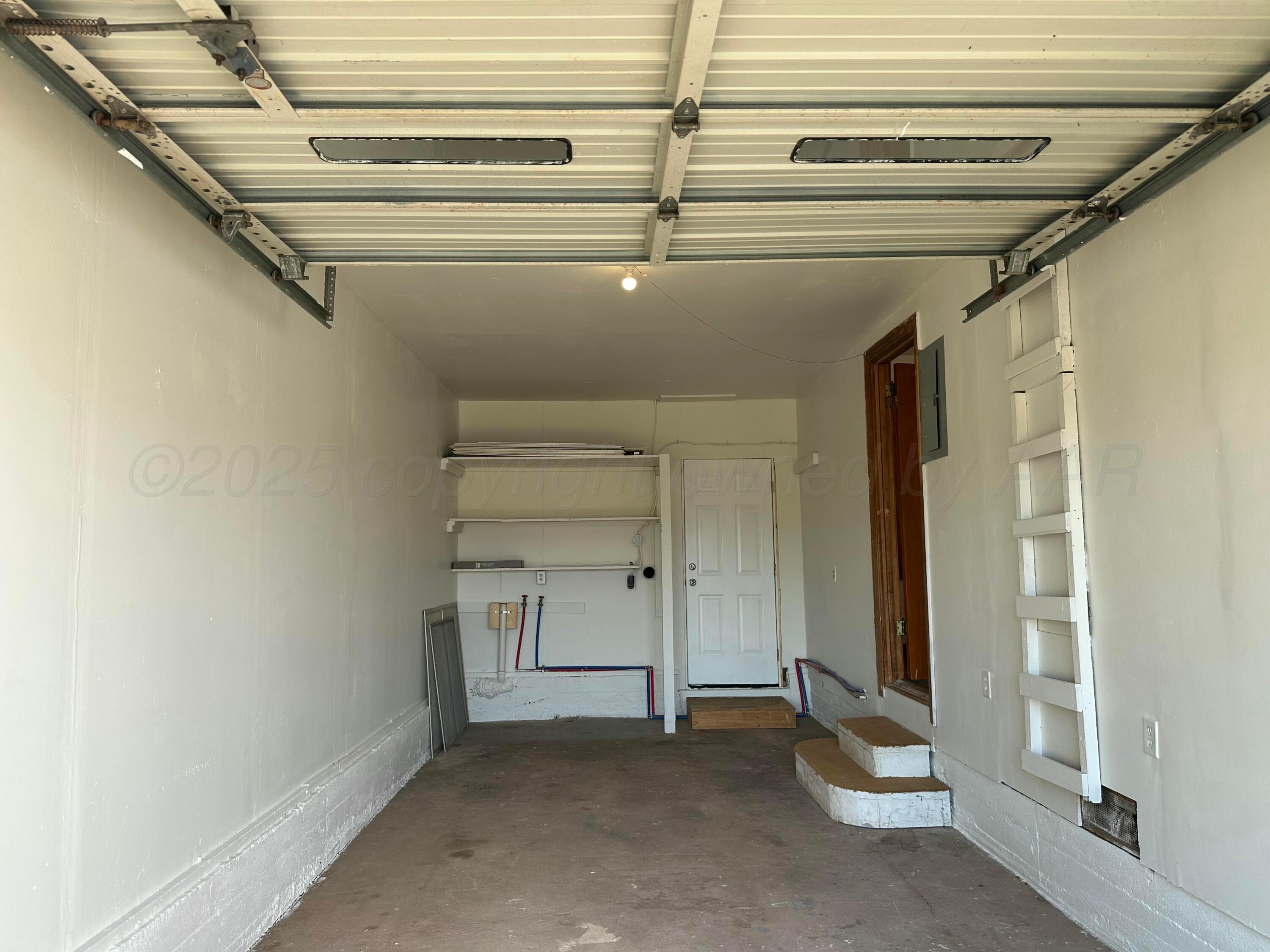 913 Bell Avenue Turkey, TX 79261 - Photo 16 of 18 a view of a room with rack and white walls