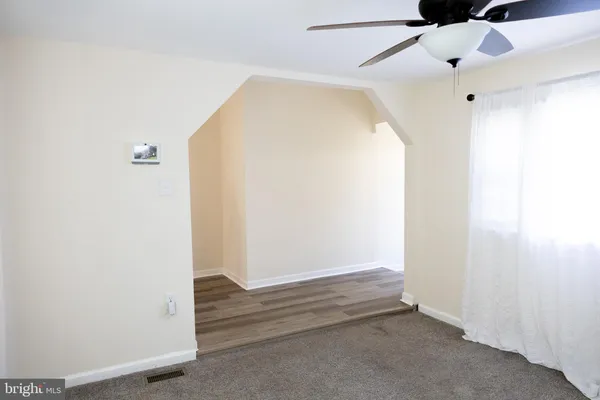 an empty room with wooden floor
