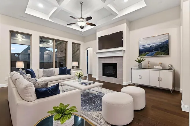 a view of an empty room with a fireplace and a window