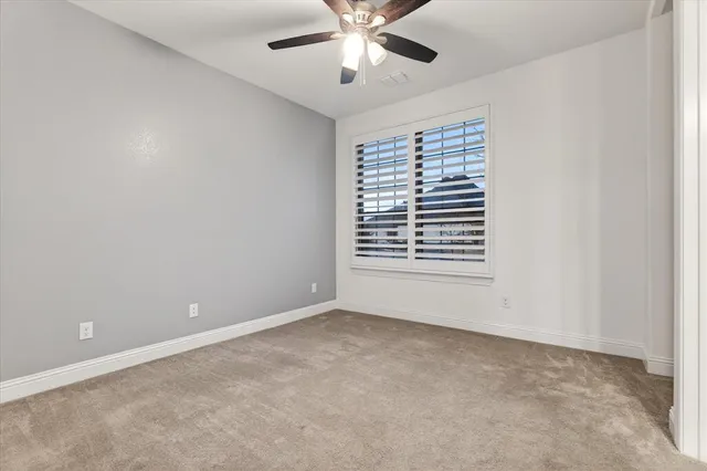 an empty room with a empty space and windows