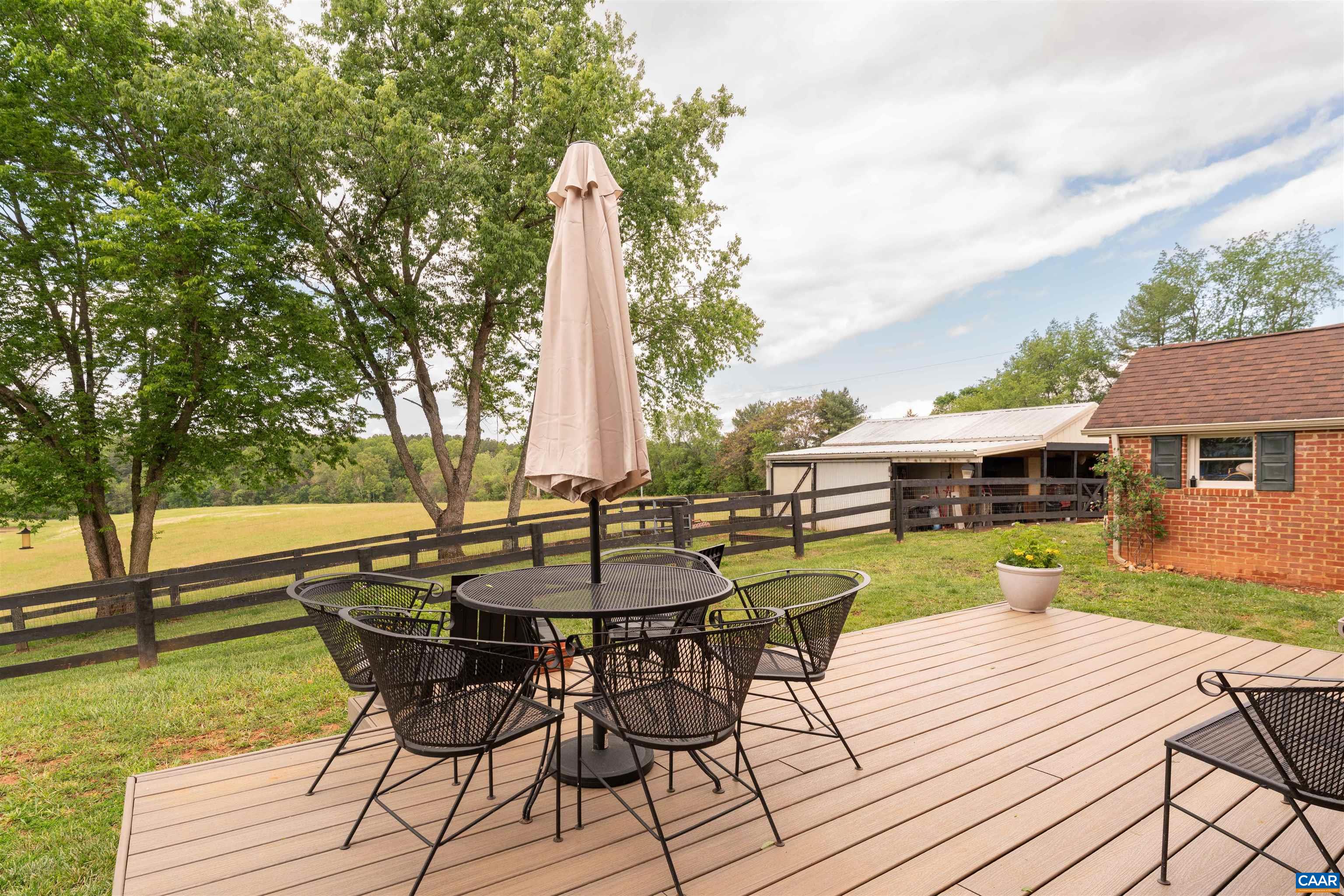 3486 Fredericksburg Road Ruckersville, VA 22968 - Photo 23 of 37 a view of a wooden deck and a patio