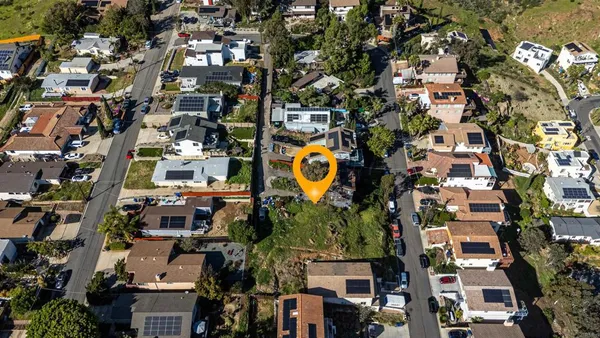 an aerial view of a multi story residential apartment building with yard