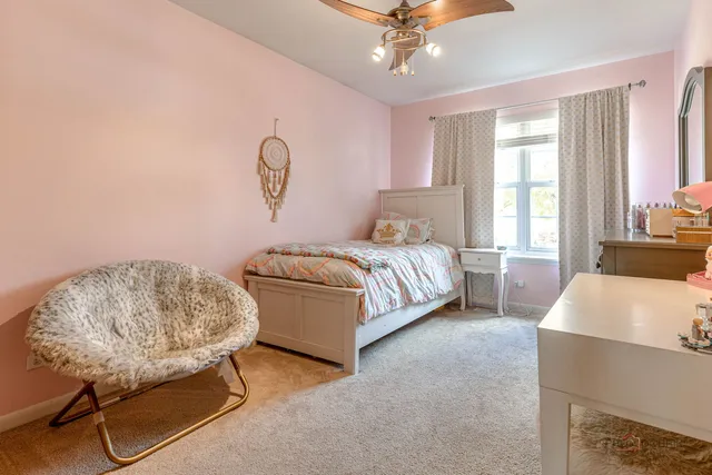 a bedroom with a bed and dresser