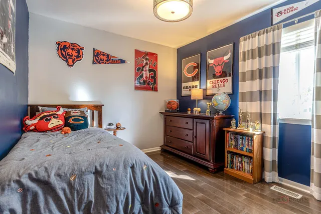 a bedroom with a bed and a closet