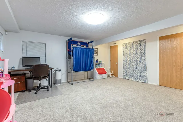 a view of a chairs and table in the patio