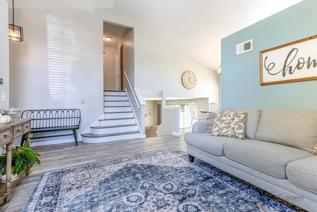 a living room with furniture and a rug