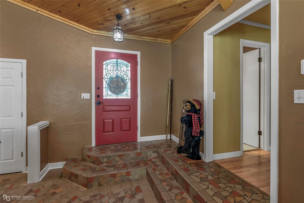 10865 Ferry Lake Road Oil City, LA 71061 - Photo 16 of 36 Entrance foyer with crown molding and wooden ceiling
