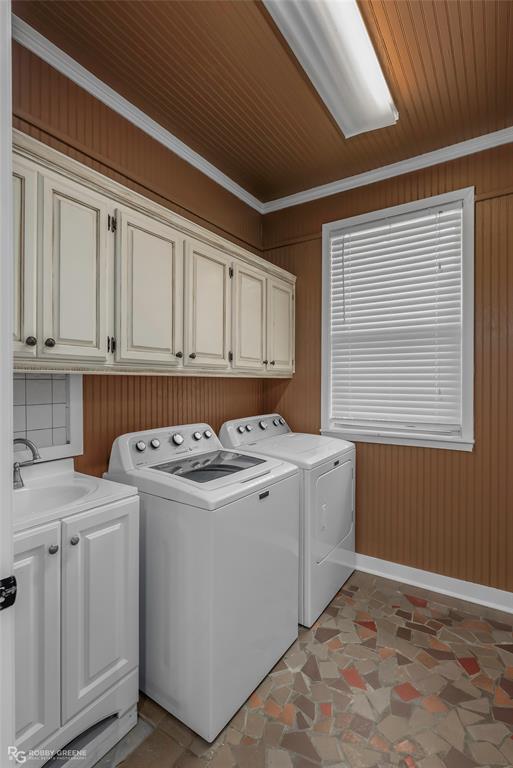 10865 Ferry Lake Road Oil City, LA 71061 - Photo 23 of 36 Laundry room with cabinet space, washer and dryer, wood walls, ornamental molding, and wood ceiling