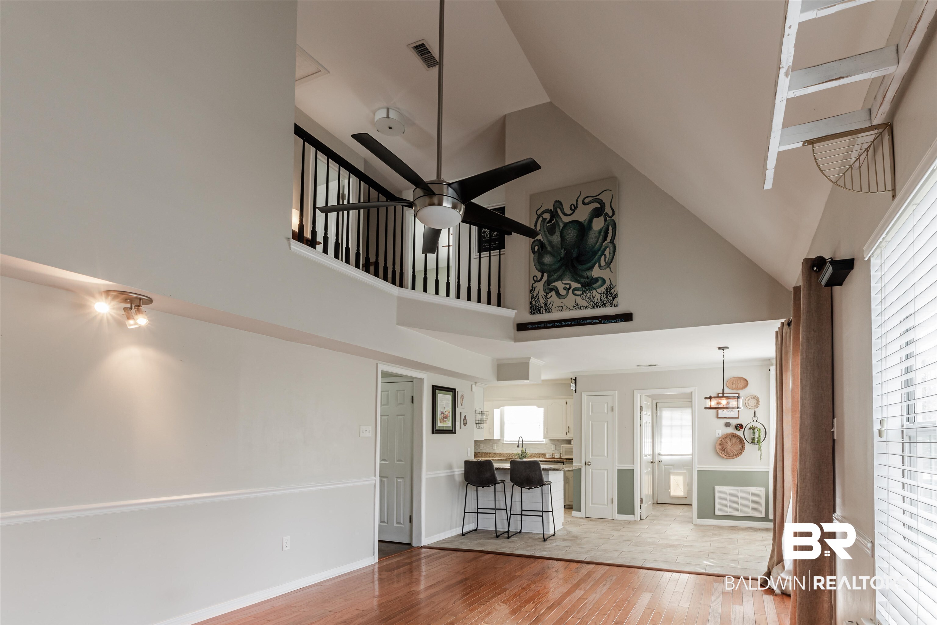 3844 Isabel Way South Mobile, AL 36693 - Photo 17 of 49 Unfurnished living room featuring hardwood / wood-style flooring, high vaulted ceiling, and ceiling fan