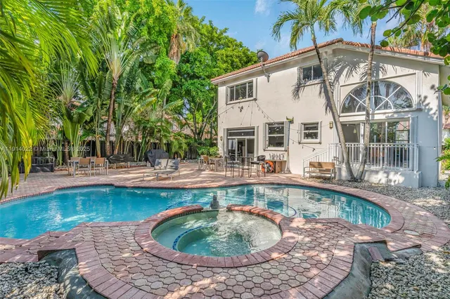 a view of a swimming pool with a patio