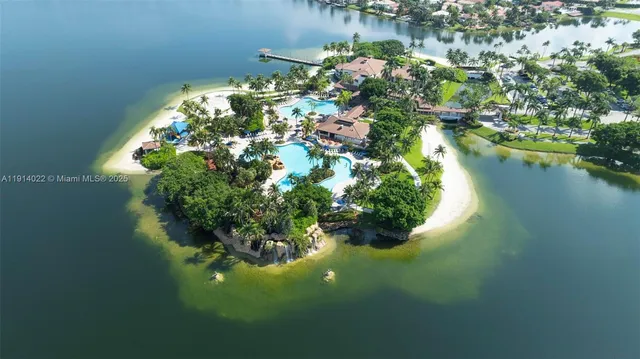 an aerial view of a house with a lake view