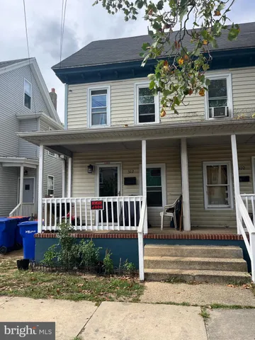 a front view of a house with a porch