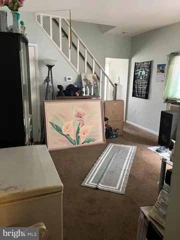 a view of a living room and dining room