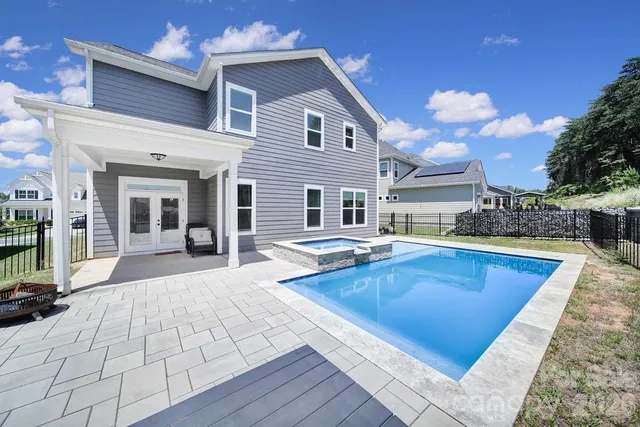 a view of a house with pool table and chairs