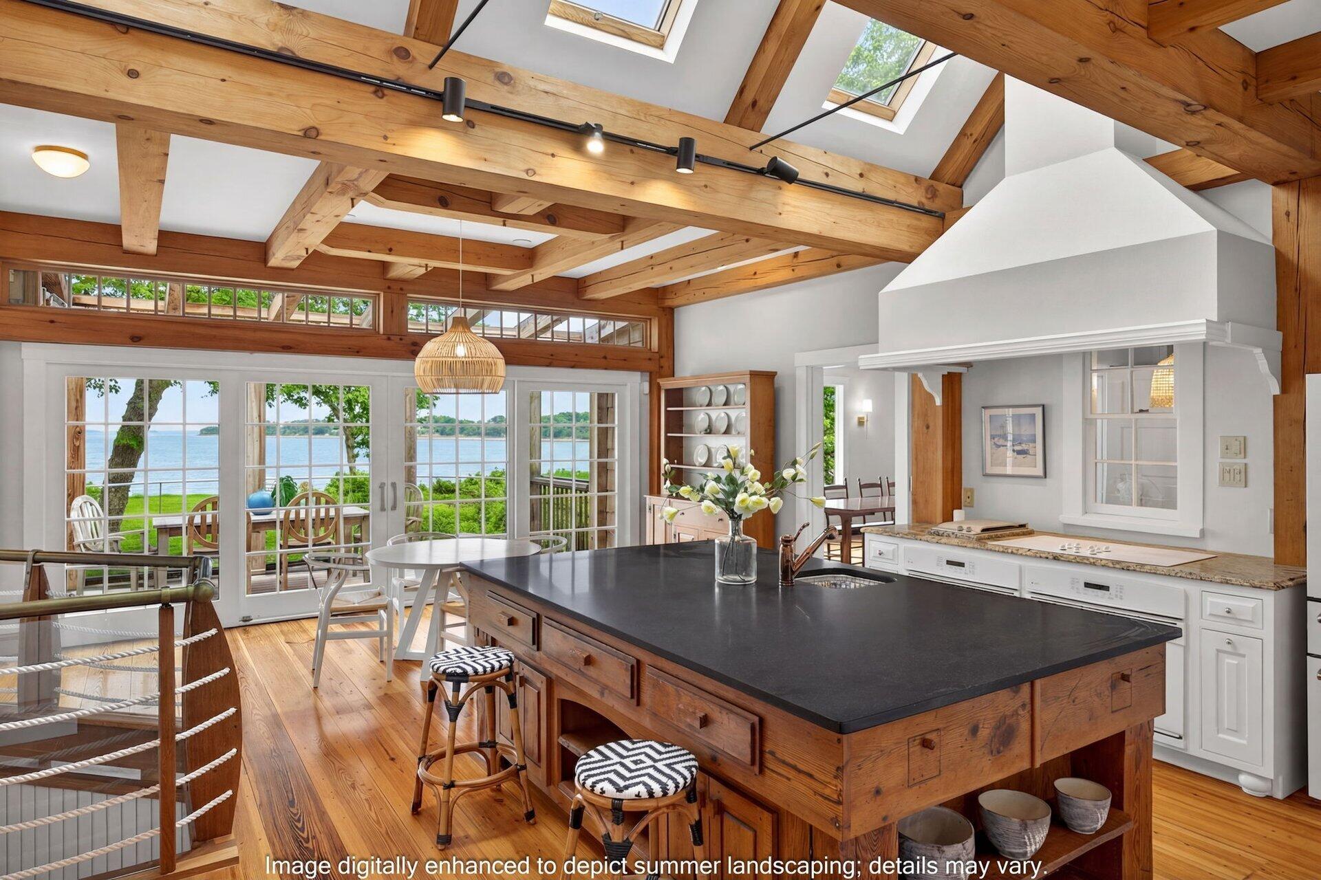 2079 Head Of The Bay Road Harwich, MA 02645 - Photo 16 of 43 a view of a dining room with furniture wooden floor and chandelier