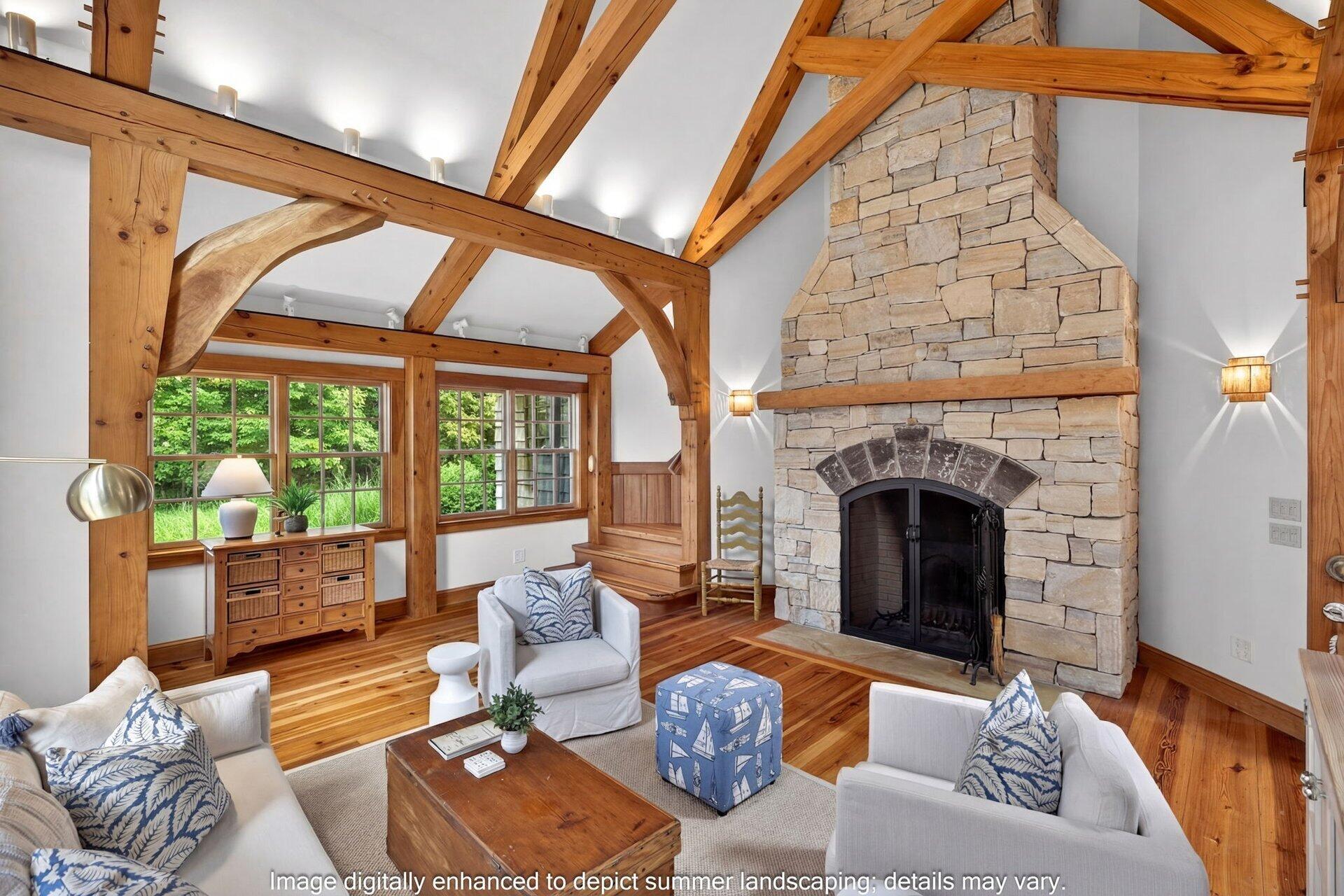 2079 Head Of The Bay Road Harwich, MA 02645 - Photo 22 of 43 a living room with furniture a fireplace and a floor to ceiling window