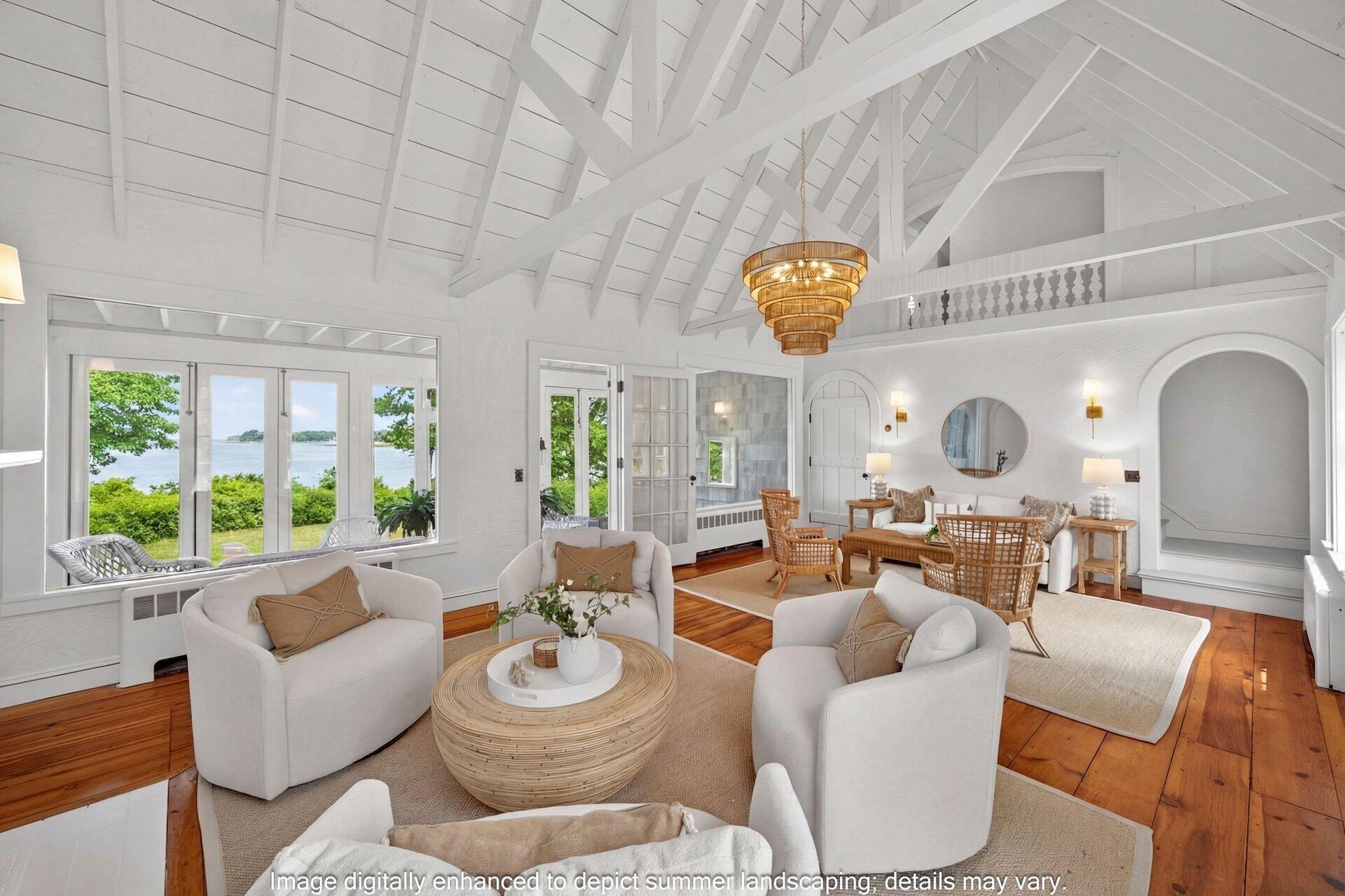 2079 Head Of The Bay Road Harwich, MA 02645 - Photo 10 of 43 a living room with furniture a fireplace and a large window