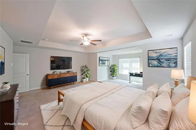 a spacious bathroom with a granite countertop tub sink and mirror