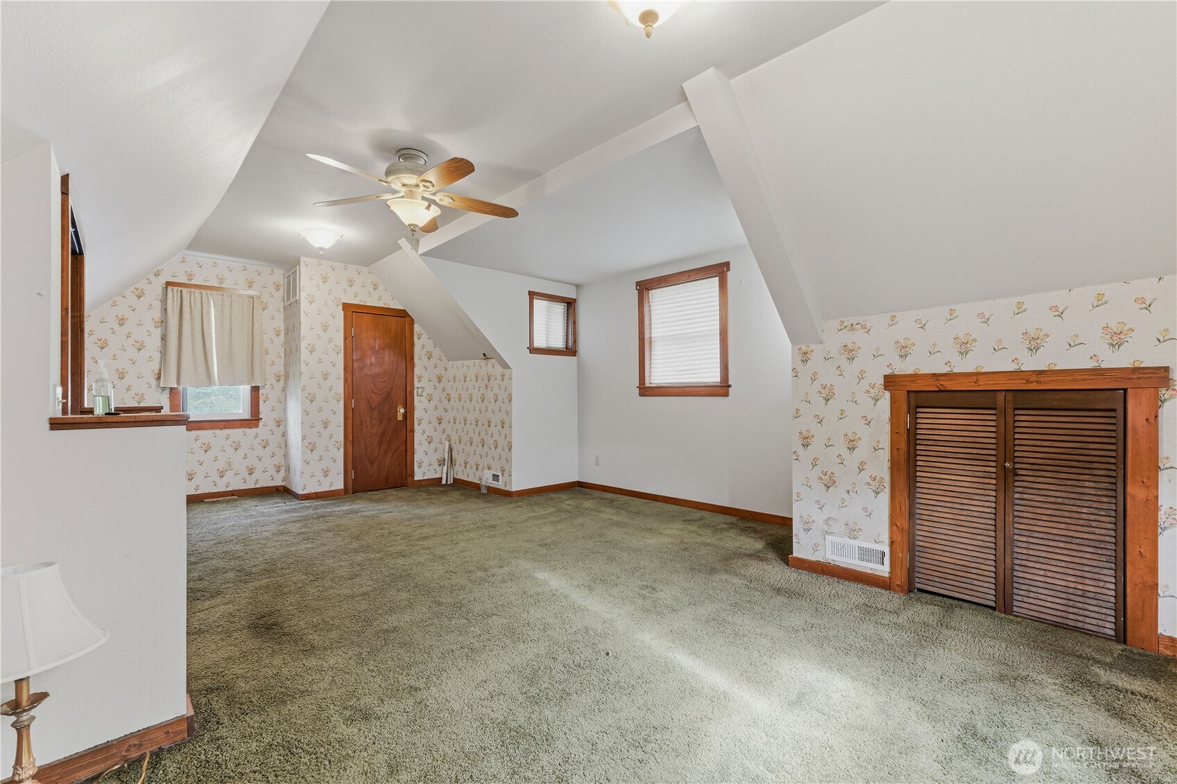 5601 Airport Road Cashmere, WA 98815 - Photo 15 of 36 an empty room with a fireplace and fan