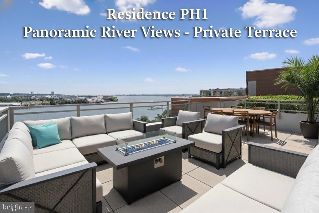 a view of a roof deck with furniture