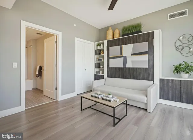 a living room with furniture and a window