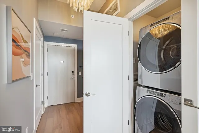 a view of a hallway with washer and dryer