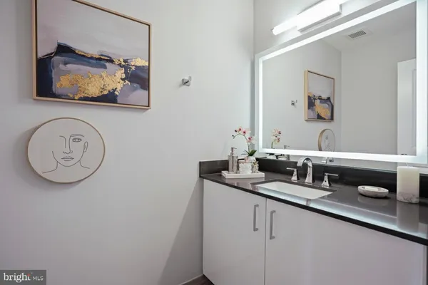 a sign in front of a wall