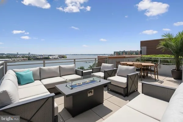 a kitchen with granite countertop a sink and cabinets