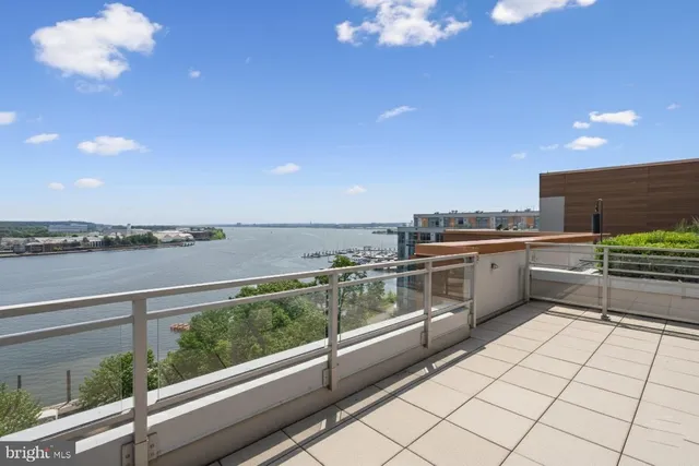 a view of a wooden deck and a yard