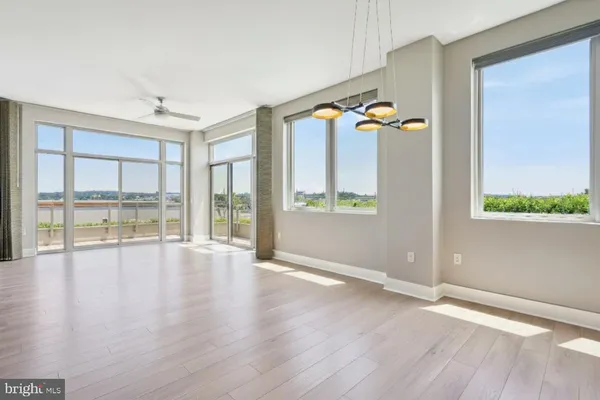 a view of a room with wooden floor and bathroom