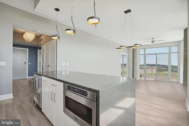 a bathroom with a sink a mirror and shower