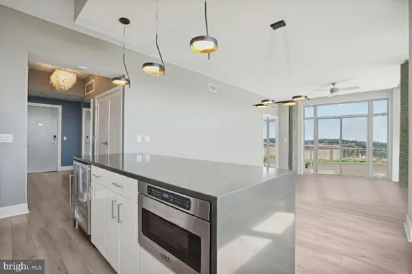 a living room with a couch and a wooden floor