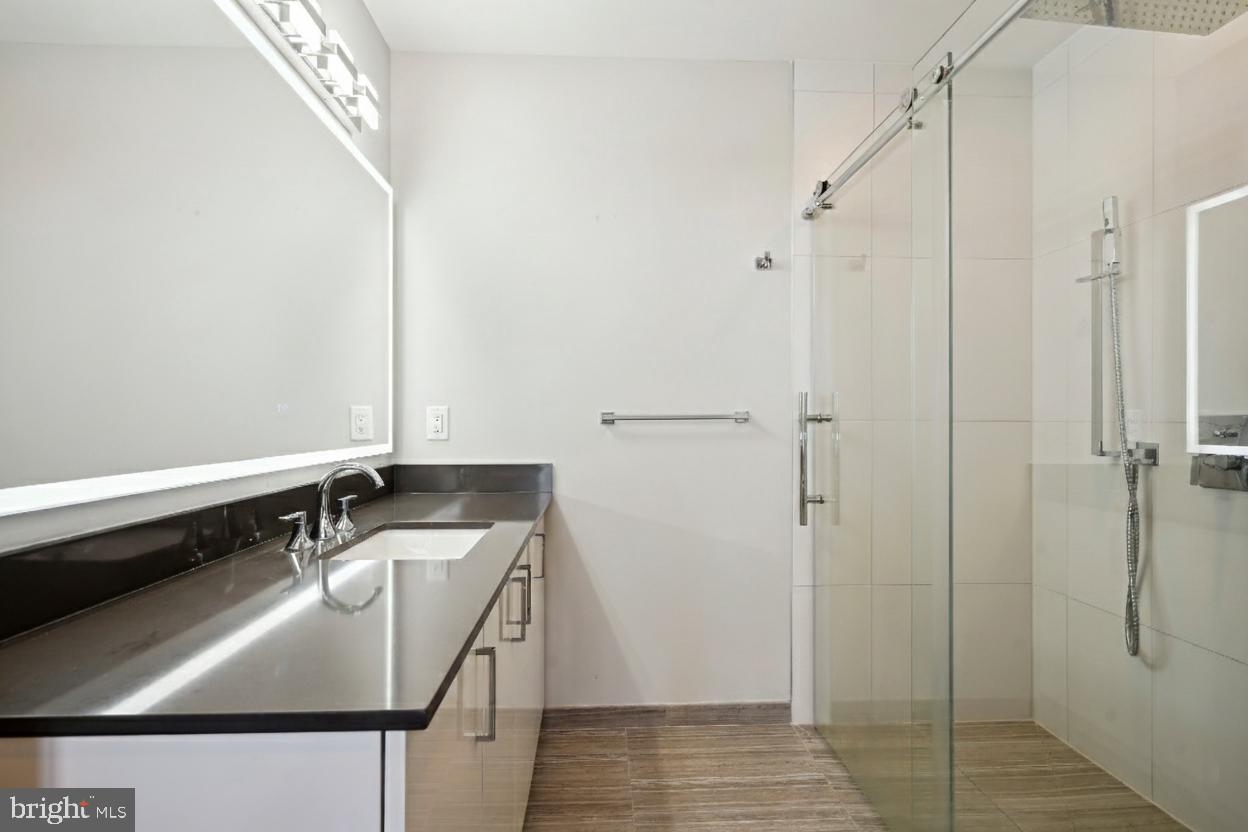 88 V Street Southwest, Unit PH1 Washington, DC 20024 - Photo 43 of 66 Primary bathroom with oversized rain shower head