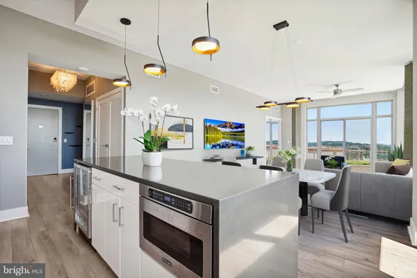 a kitchen with white cabinets and a stove top oven